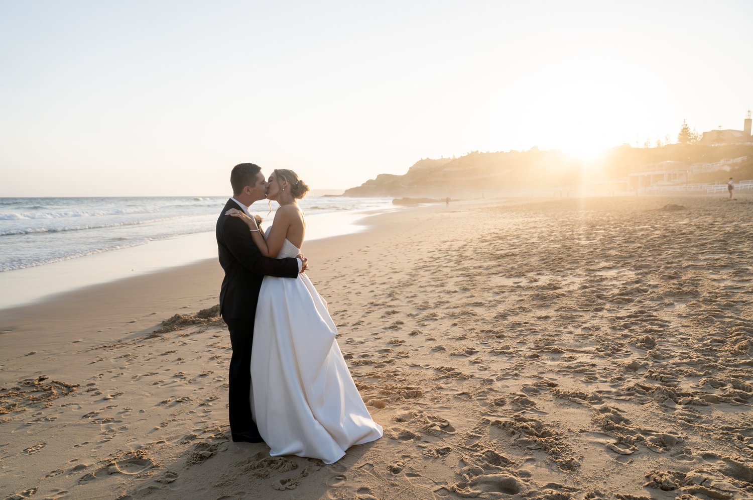 A kiss on the beach at sunrise. 's wedding at unknown, unknown