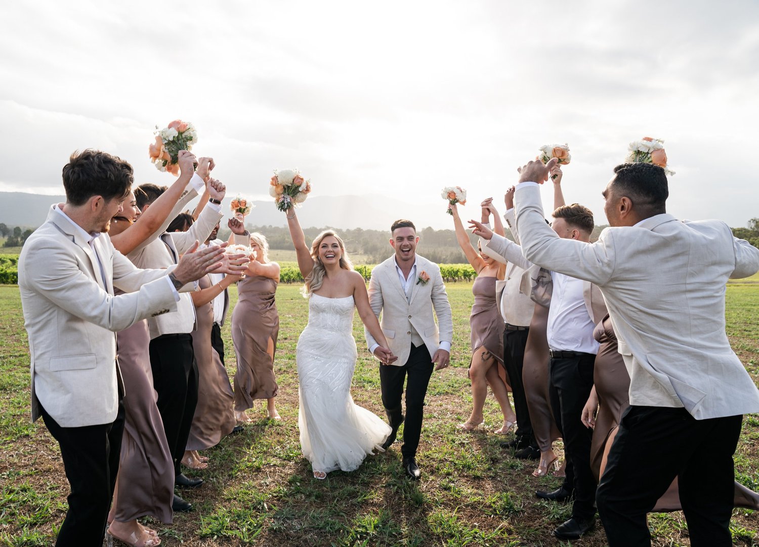 The wedding party cheering. 's wedding at unknown, unknown