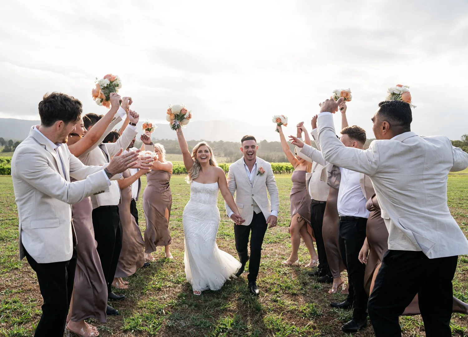 The wedding party cheering