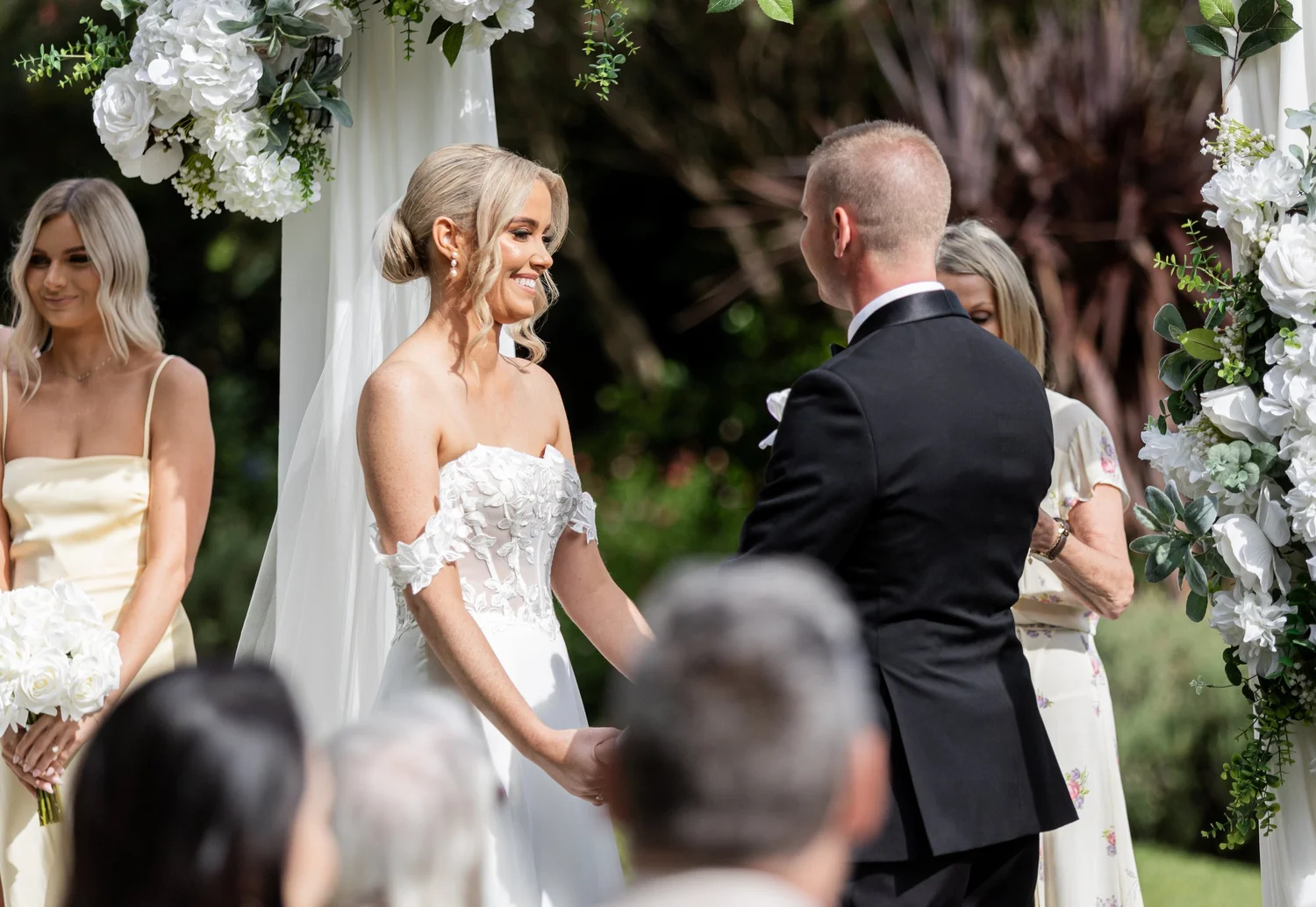 Vows under a floral arch