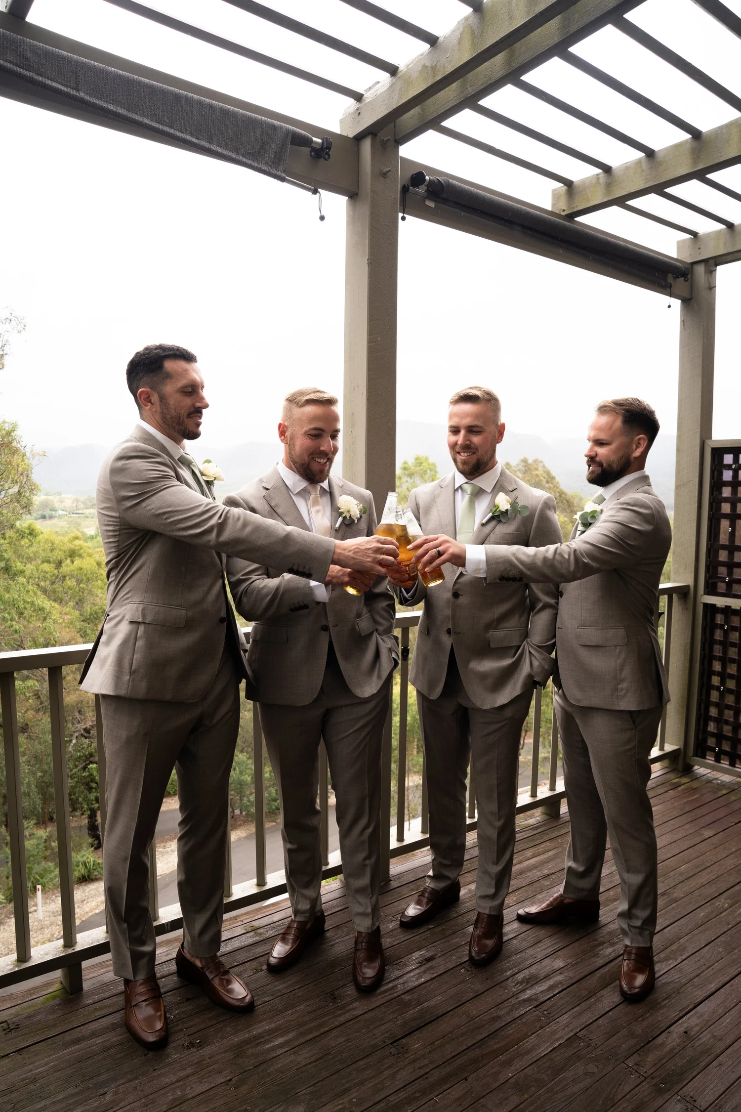 The wedding party celebrating on a deck