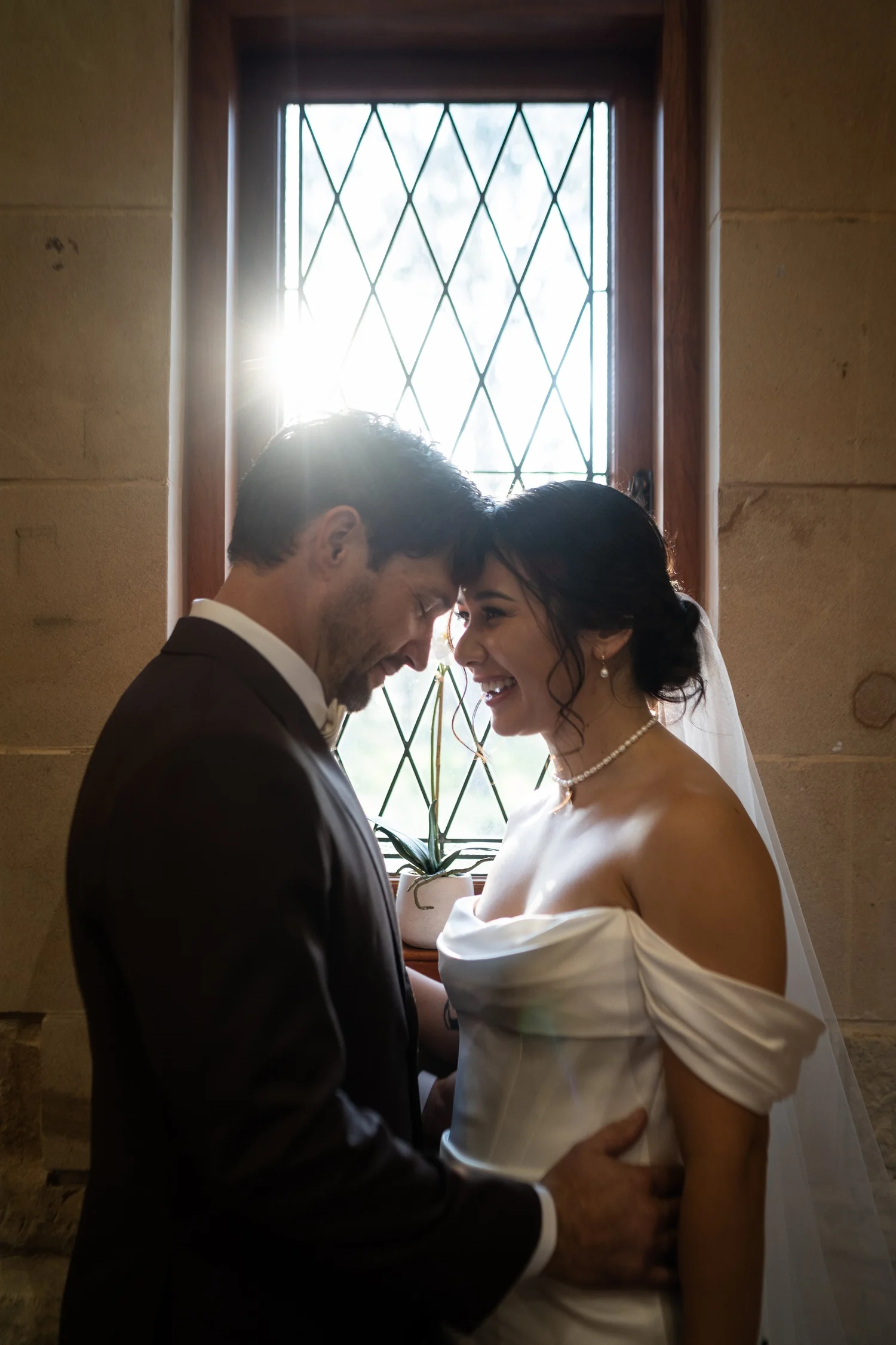 A quiet moment by a leadlight window