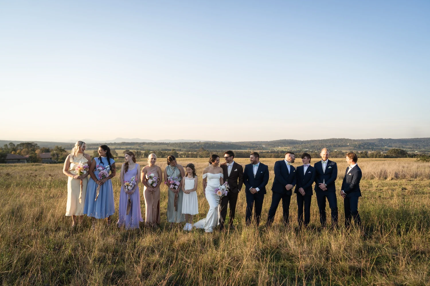 The wedding party in a field