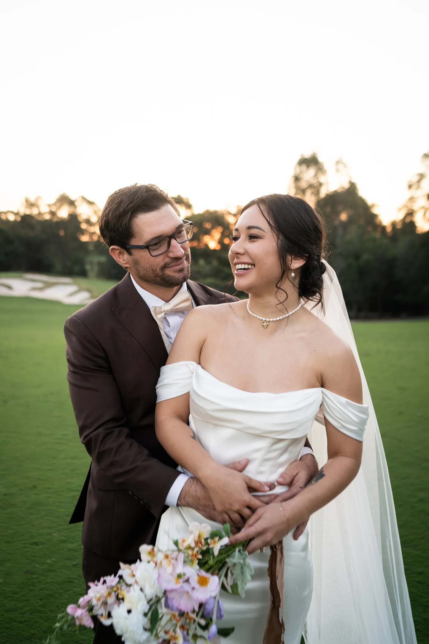 The couple laughing on the lawn