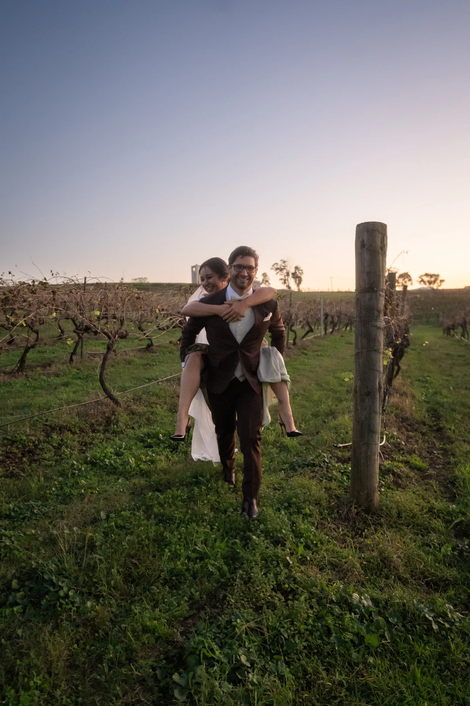 The couple in a paddock at dusk