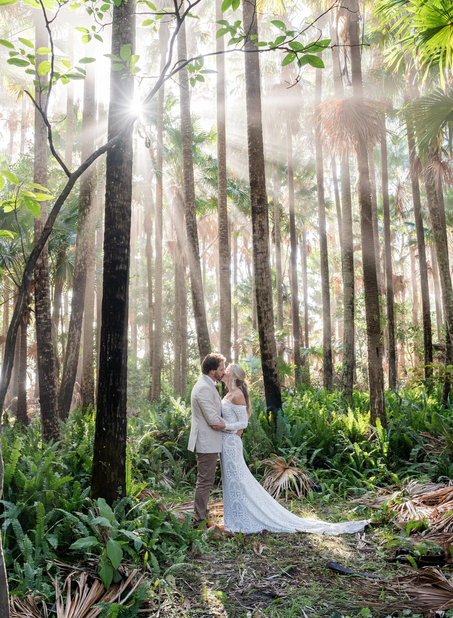The couple in the forest with sun rays