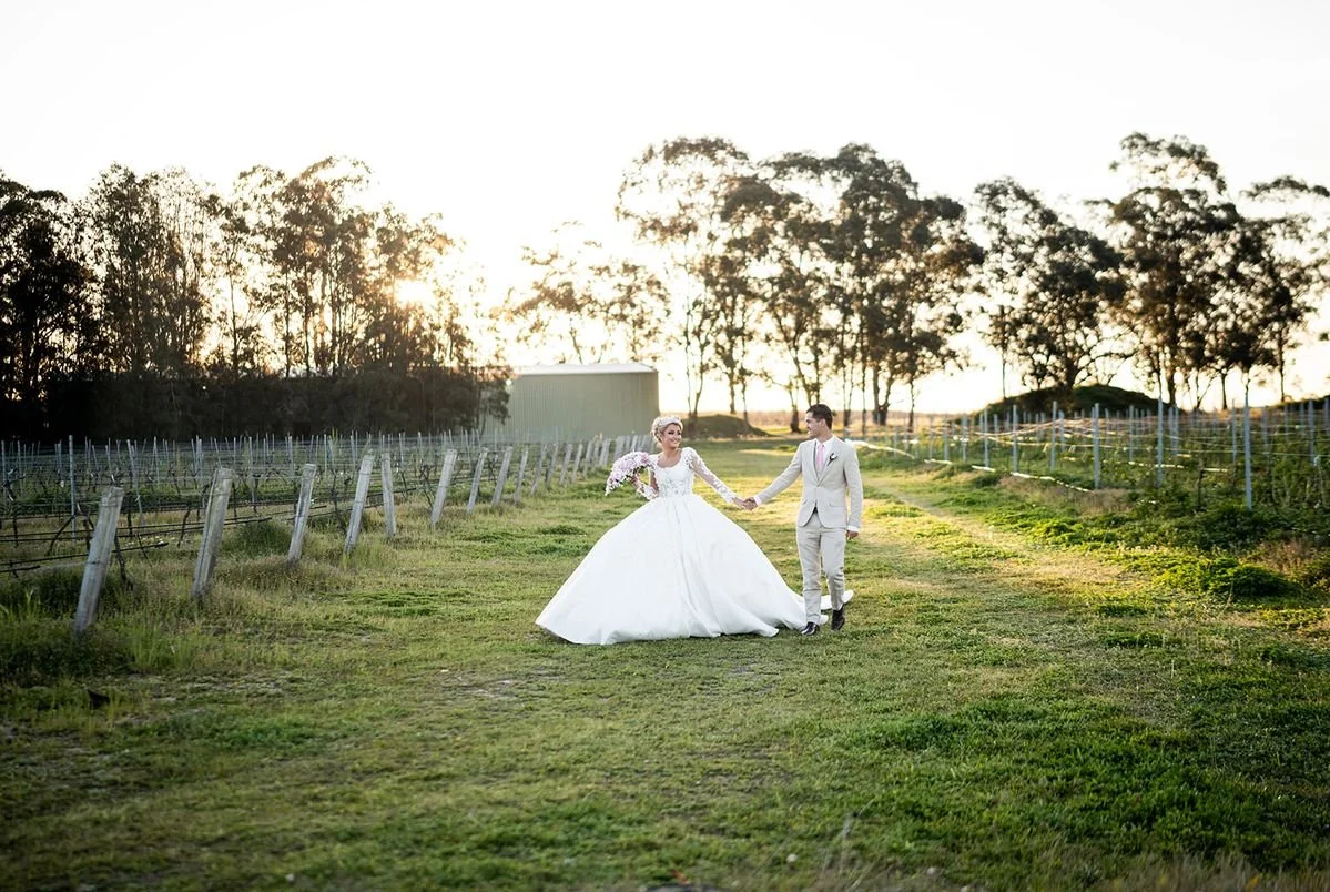 The couple in the vineyard at sunset. Wedding at Peterson House, Hunter Valley