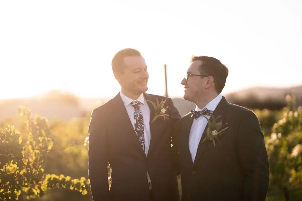 The couple at golden hour in the vineyard. Aaron & Scott's wedding at Margan Wines, Hunter Valley