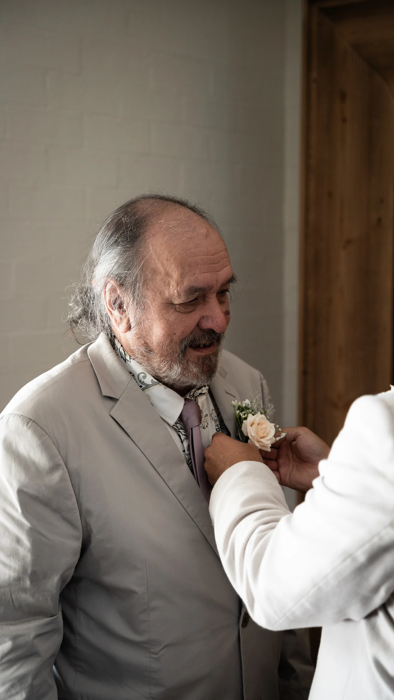 A buttonhole pinned on by family. Abbey & Tyran's wedding at Hunter Valley Gardens & Kirkton Park, Hunter Valley
