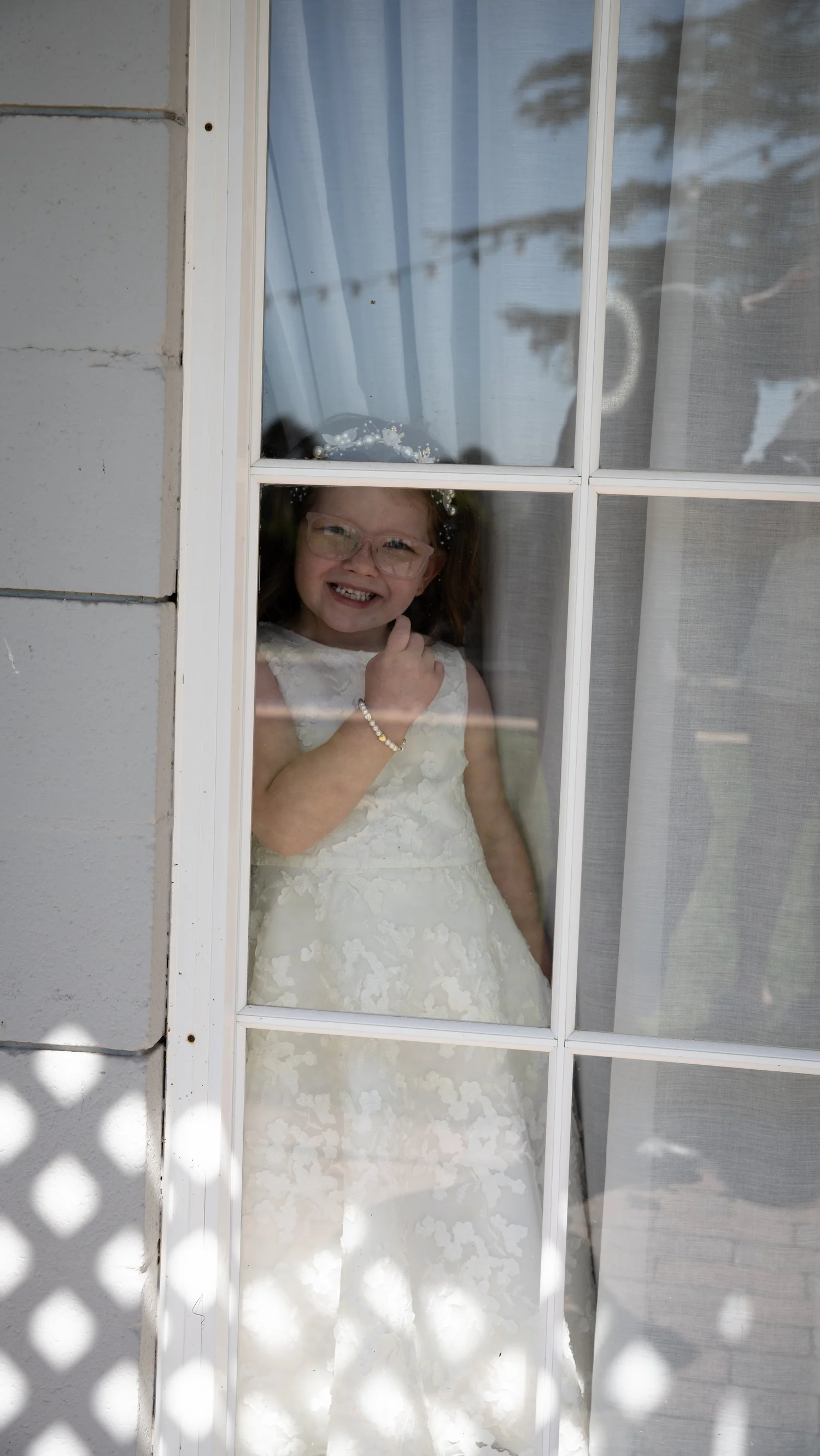 Looking out the window before the ceremony. Abbey & Tyran's wedding at Hunter Valley Gardens & Kirkton Park, Hunter Valley