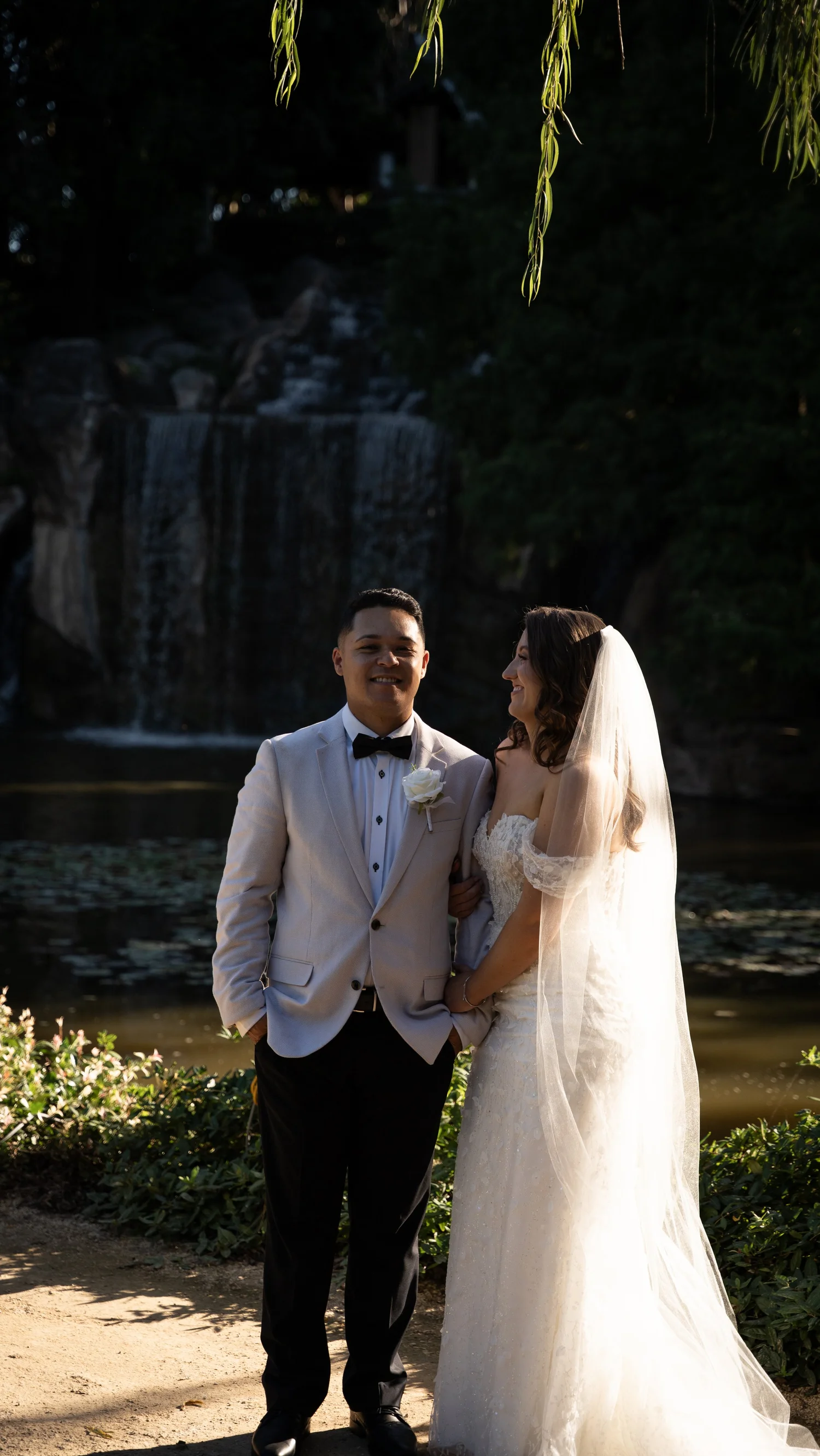 The couple in the gardens at dusk. Abbey & Tyran's wedding at Hunter Valley Gardens & Kirkton Park, Hunter Valley