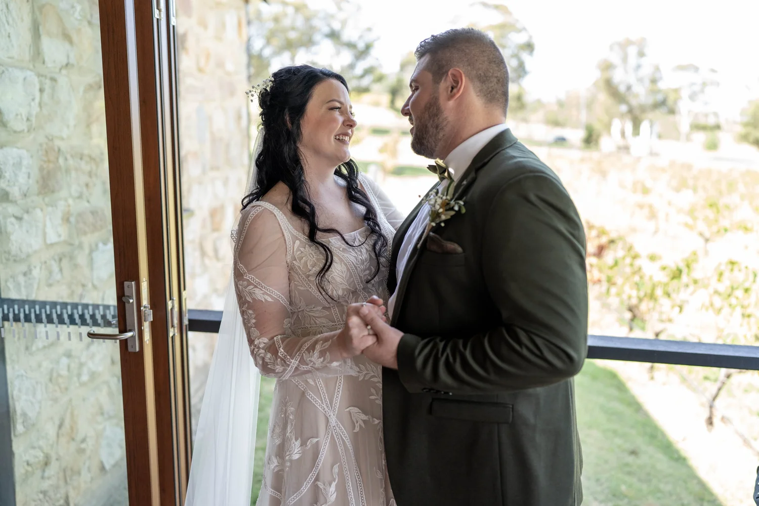 Holding hands during the ceremony. Alana & Peter's wedding at Peppers Creek, Hunter Valley