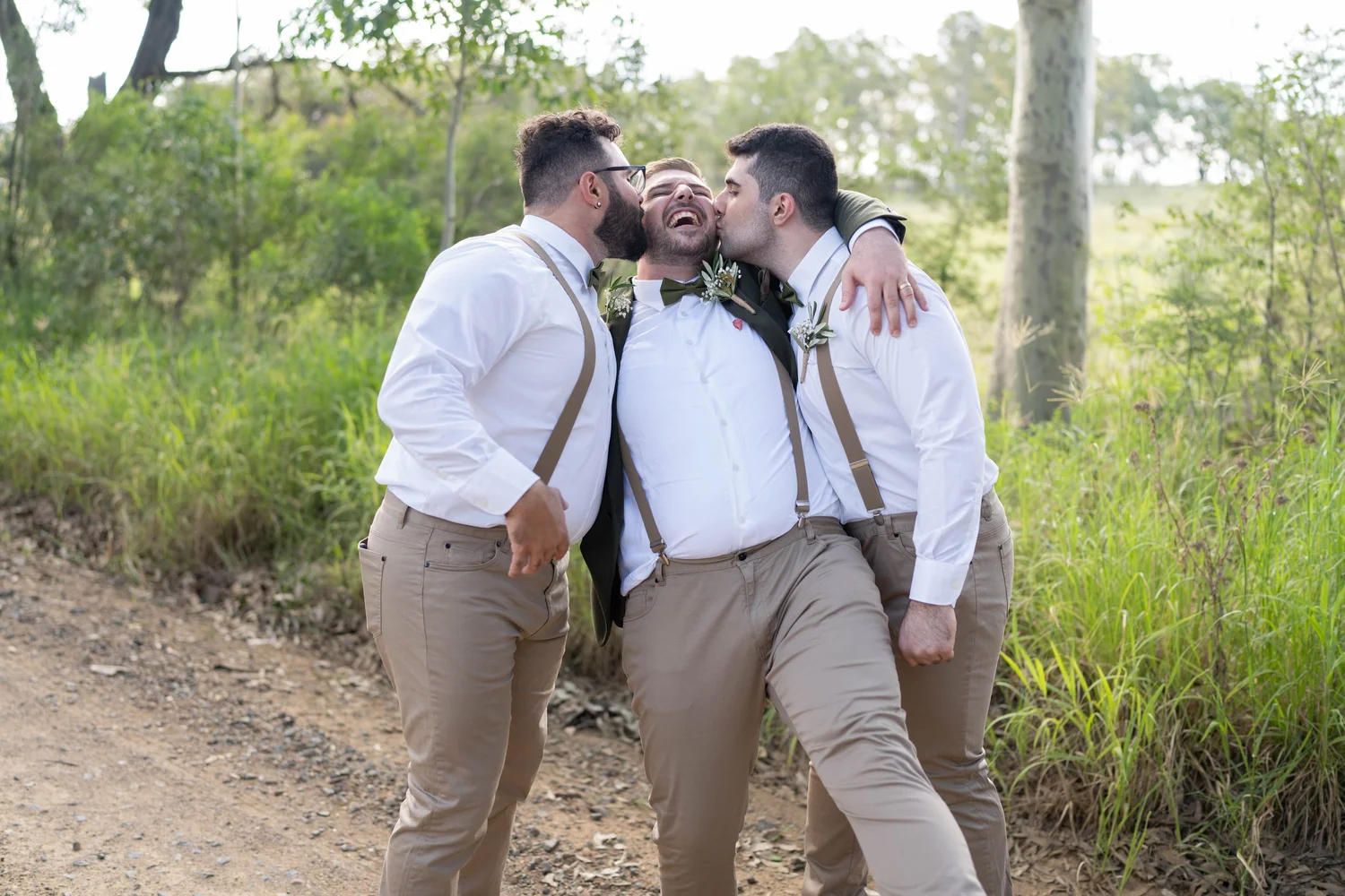 The wedding party laughing among the gum trees. Alana & Peter's wedding at Peppers Creek, Hunter Valley
