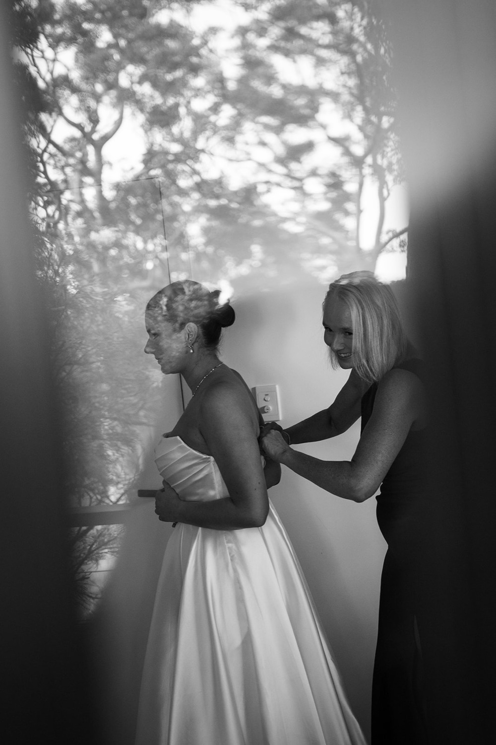 Getting into the dress, in black and white. Amelia & Connor's wedding at Glenworth Valley, Central Coast