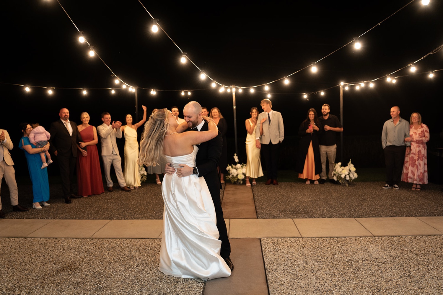 Dancing at night under festoon lights. Ashley & Justin's wedding at Haven Ridge, Grants Beach, Mid North Coast