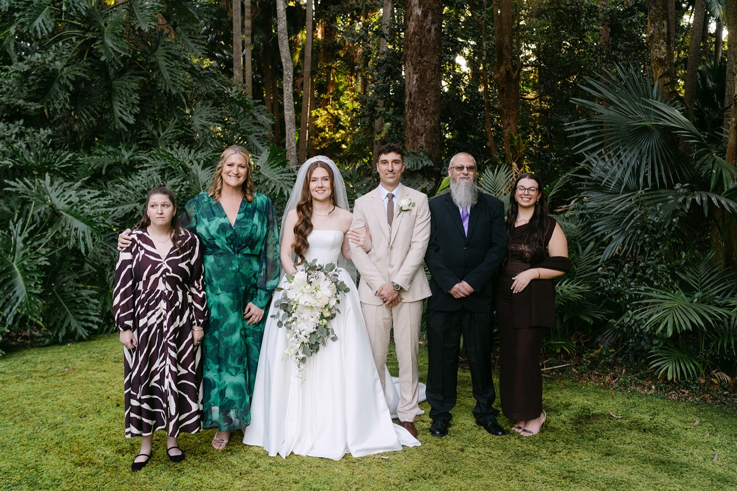 Family photo in the garden. Charlie & Lachlan's wedding at Kantara House, Central Coast