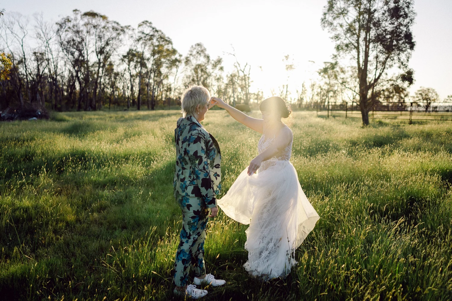 Walking through the paddock at sunset. Daena & Inez's wedding at Collits Inn, Blue Mountains