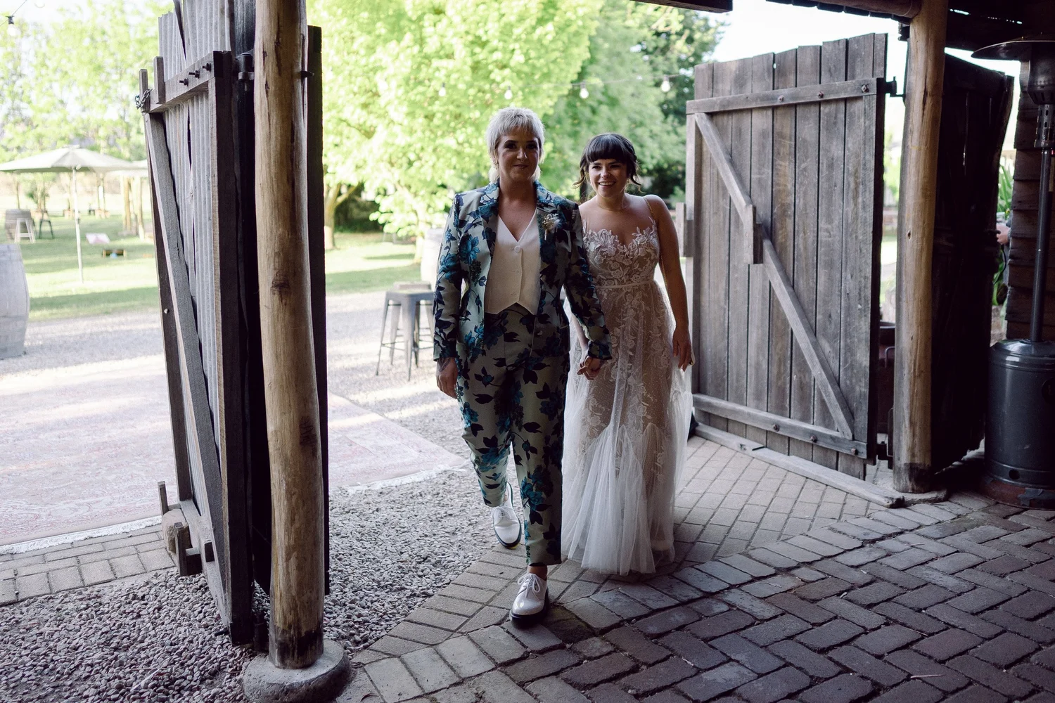 Walking out through the barn doors. Daena & Inez's wedding at Collits Inn, Blue Mountains
