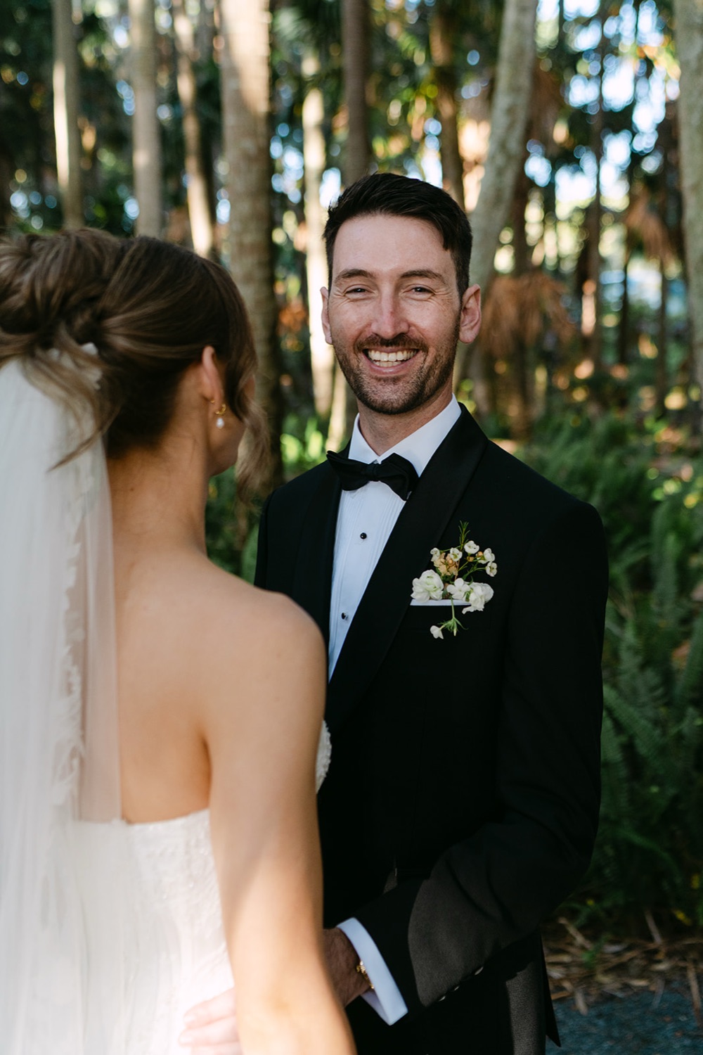 A first look in the palm forest. Demi & Kyle's wedding at Green Cathedral, Pacific Palms, Port Stephens