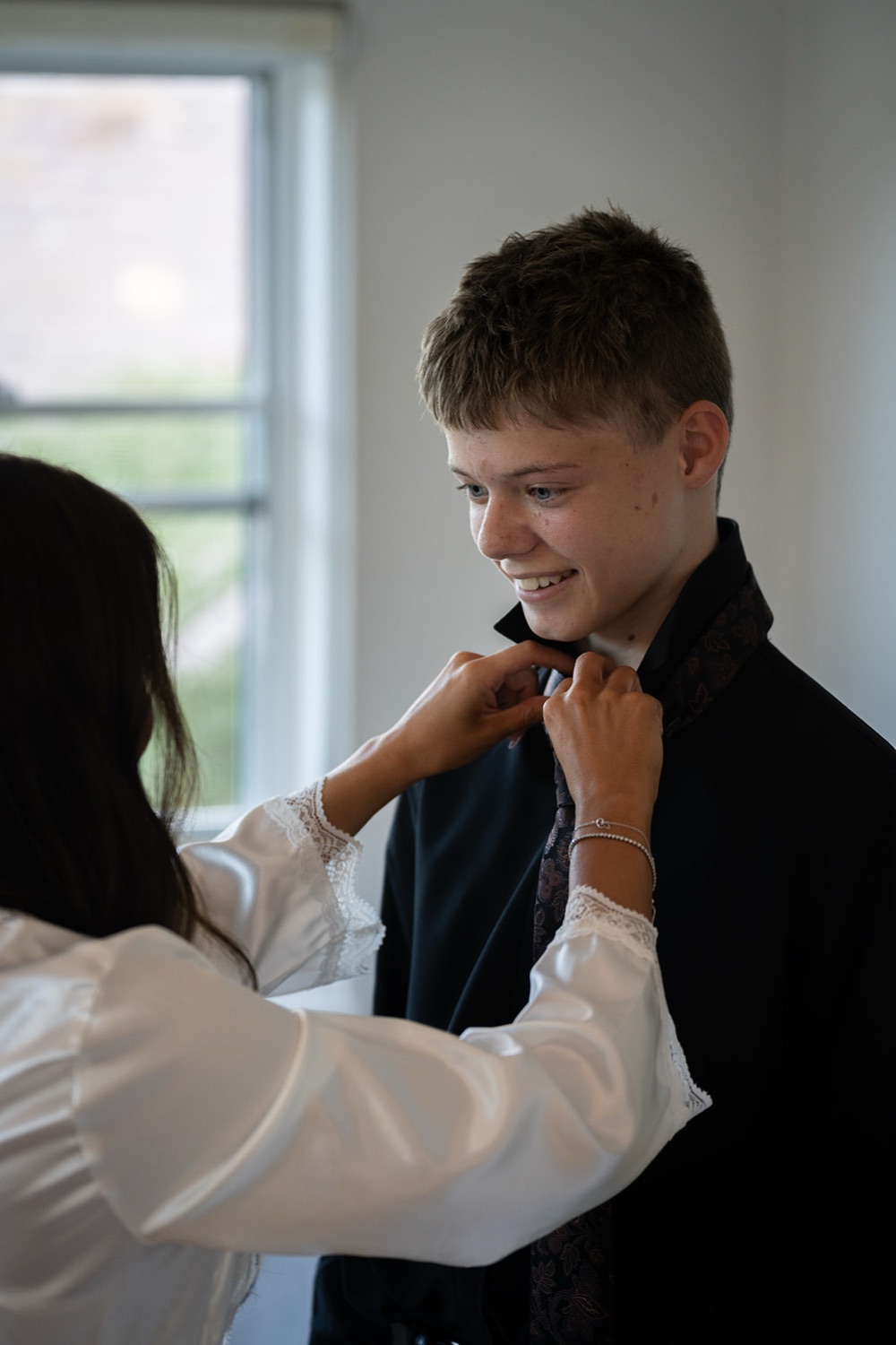 A bow tie straightened before the ceremony. Georgia & Kyle's wedding at Manly Pavilion, Sydney