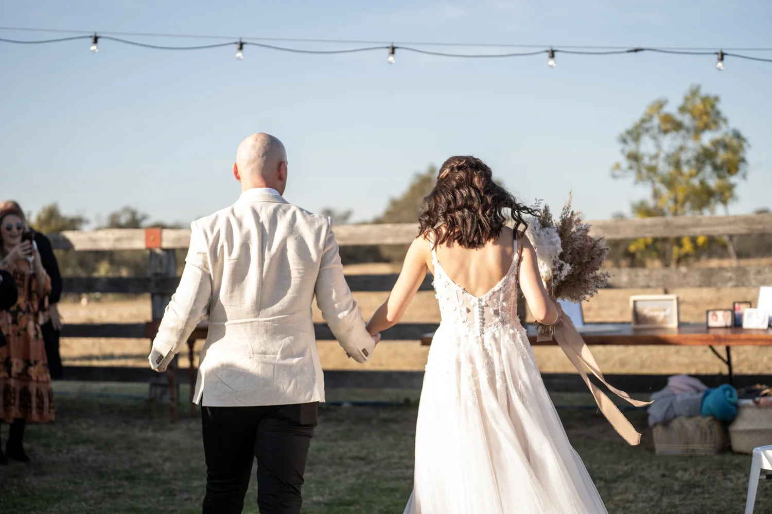 Walking toward the cattle yards. Grace & Rhys's wedding at Marlu Station, Hunter Valley