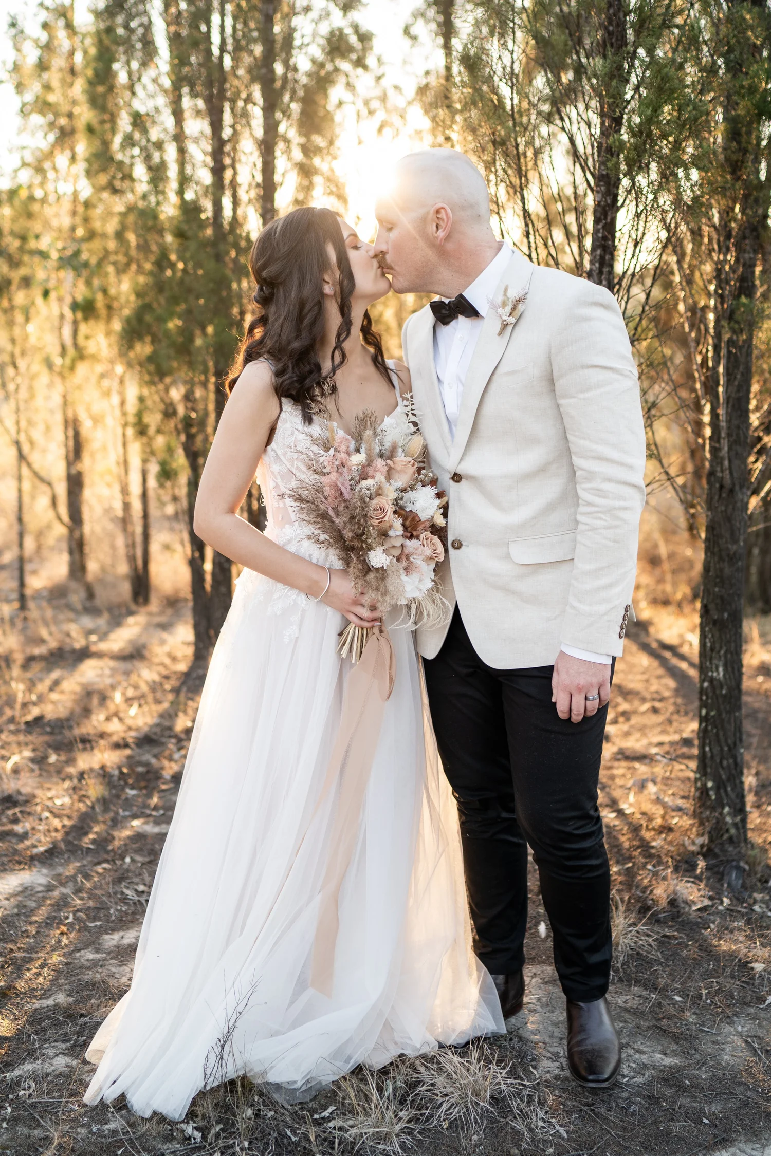 A kiss at golden hour. Grace & Rhys's wedding at Marlu Station, Hunter Valley