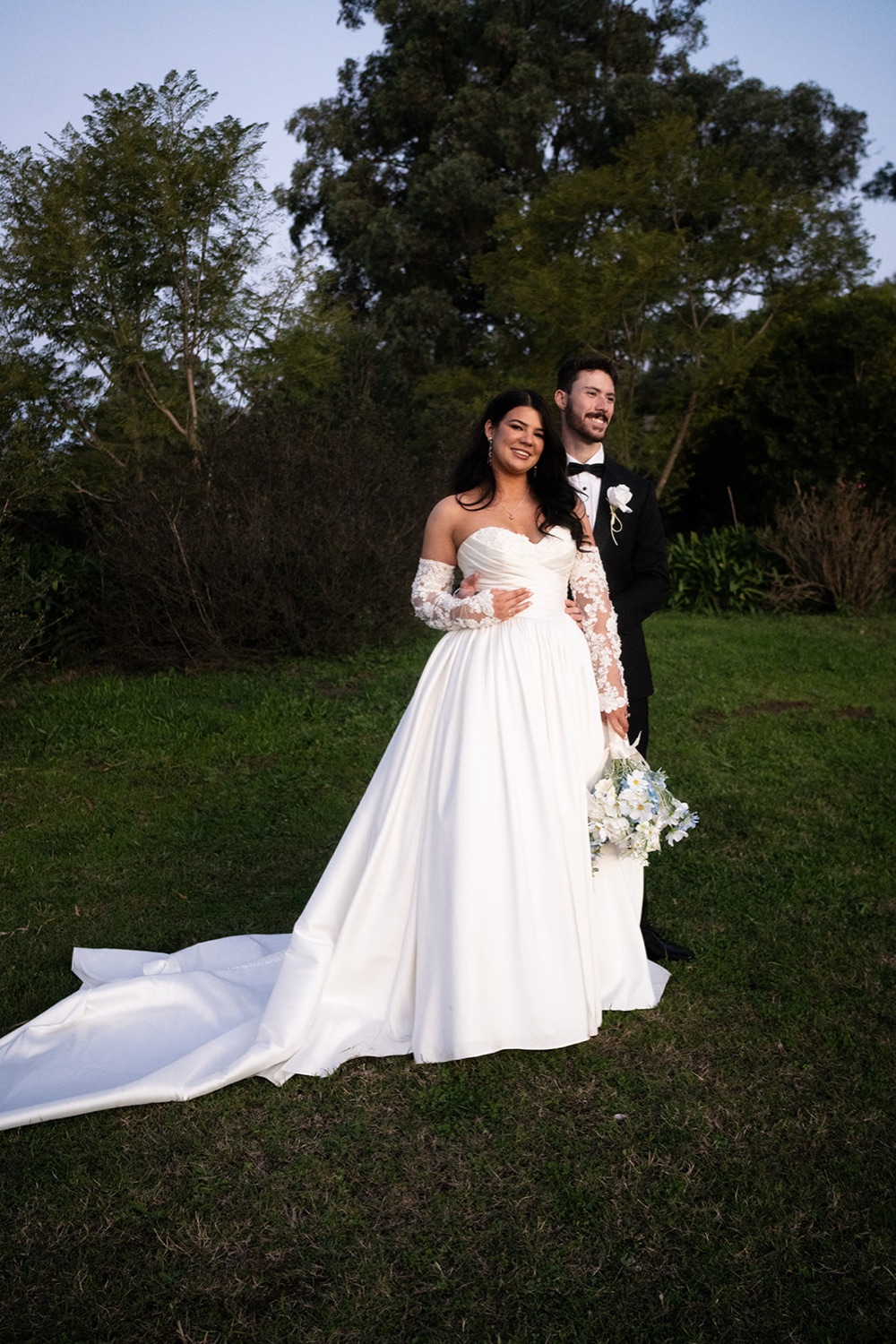 The couple on the lawn at dusk. Isabelle & Aidan's wedding at Enzo, Hunter Valley