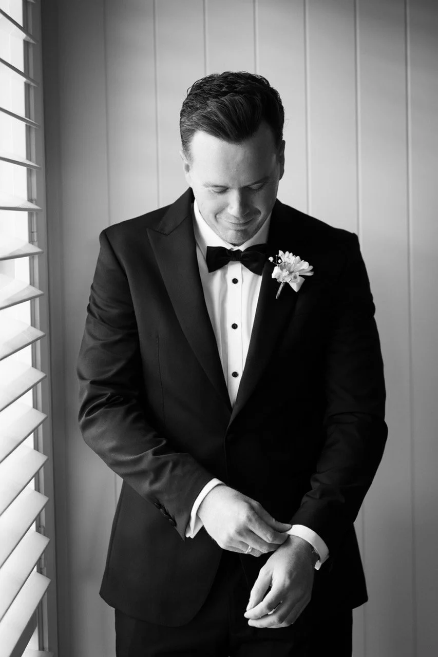 Doing up cufflinks, in black and white. Jamie & Corey's wedding at Squire’s Vineyard, Hunter Valley