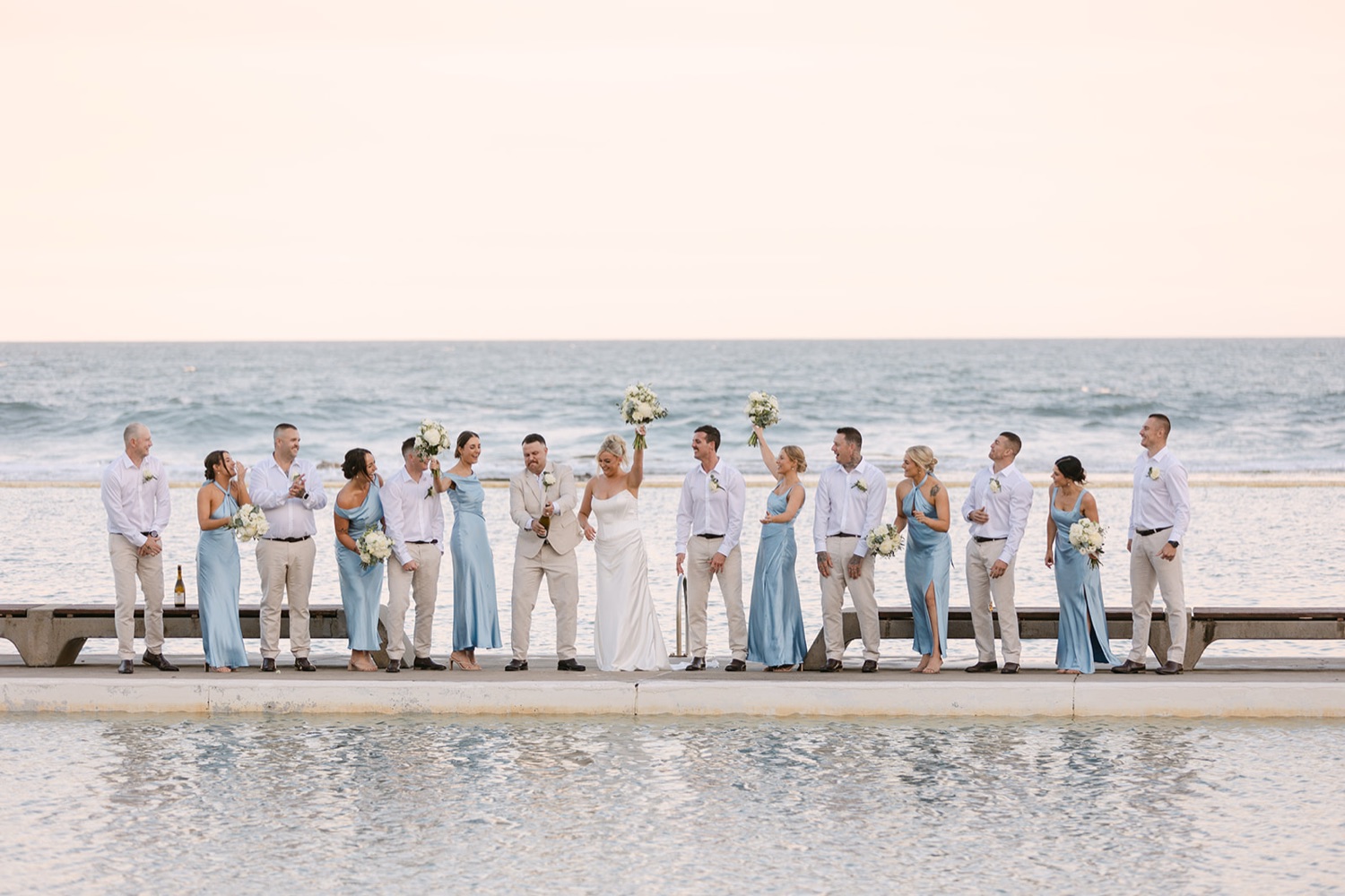 The wedding party at Merewether Ocean Baths. Jasmin & Jye's wedding at Merewether Surfhouse & Ocean Baths, Newcastle