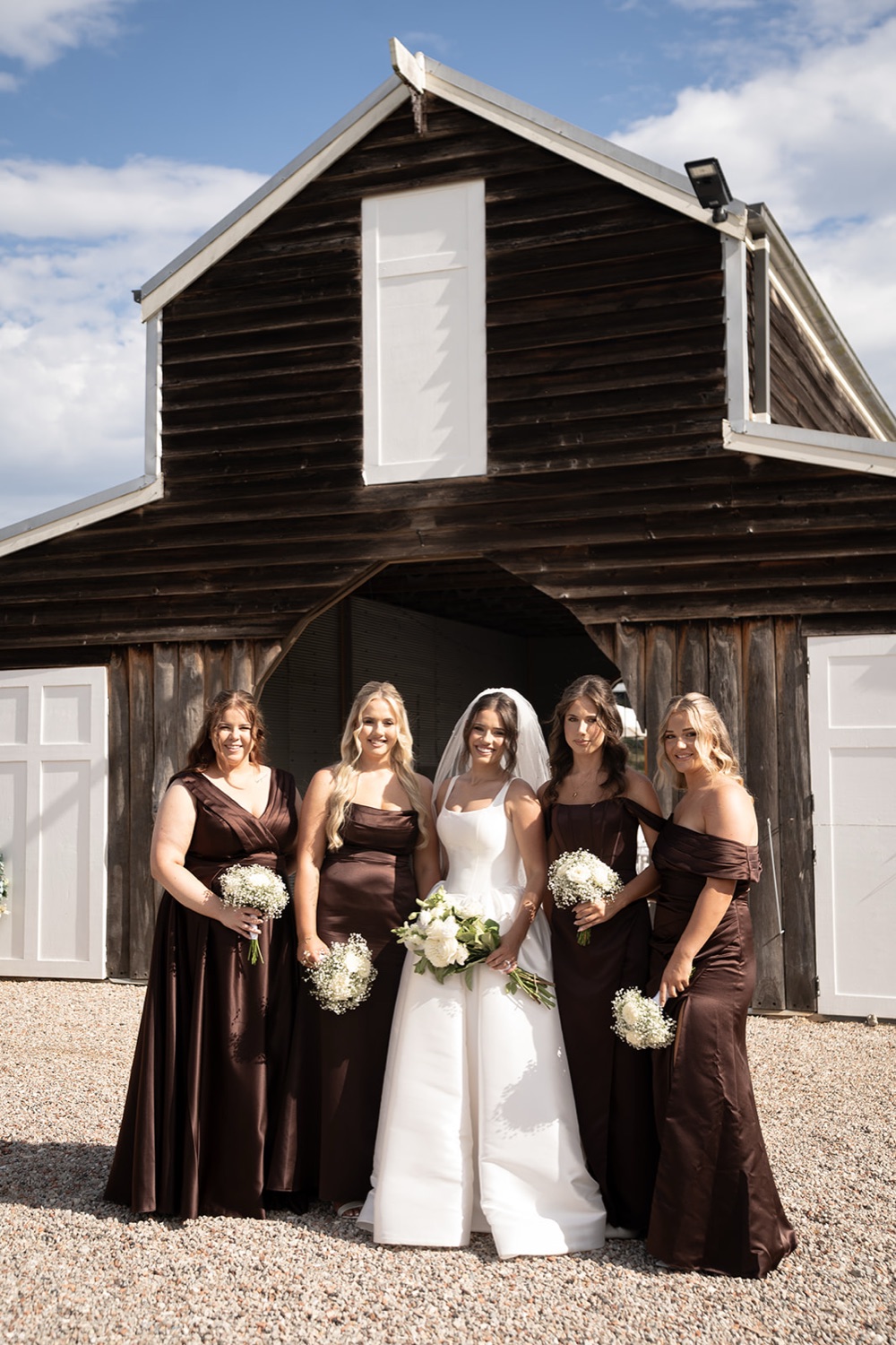 The wedding party in front of the barn doors. Jasmine & Joshua's wedding at The Lakehouse, North Richmond, Sydney