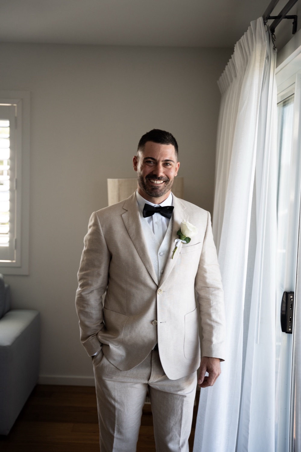 Ready in a cream suit. Jemma & Matthew's wedding at Caves Coastal Bar & Bungalows, Newcastle