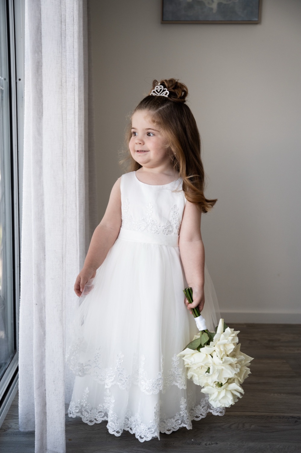 The flower girl in white. Jemma & Matthew's wedding at Caves Coastal Bar & Bungalows, Newcastle