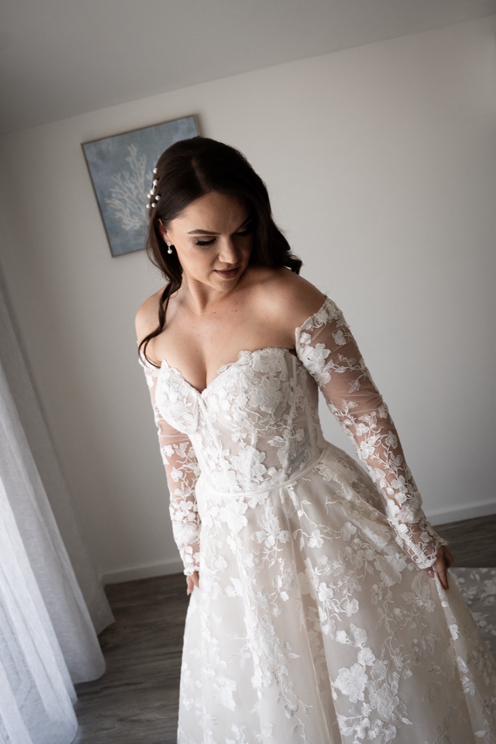 Ready in an off-the-shoulder lace dress. Jemma & Matthew's wedding at Caves Coastal Bar & Bungalows, Newcastle