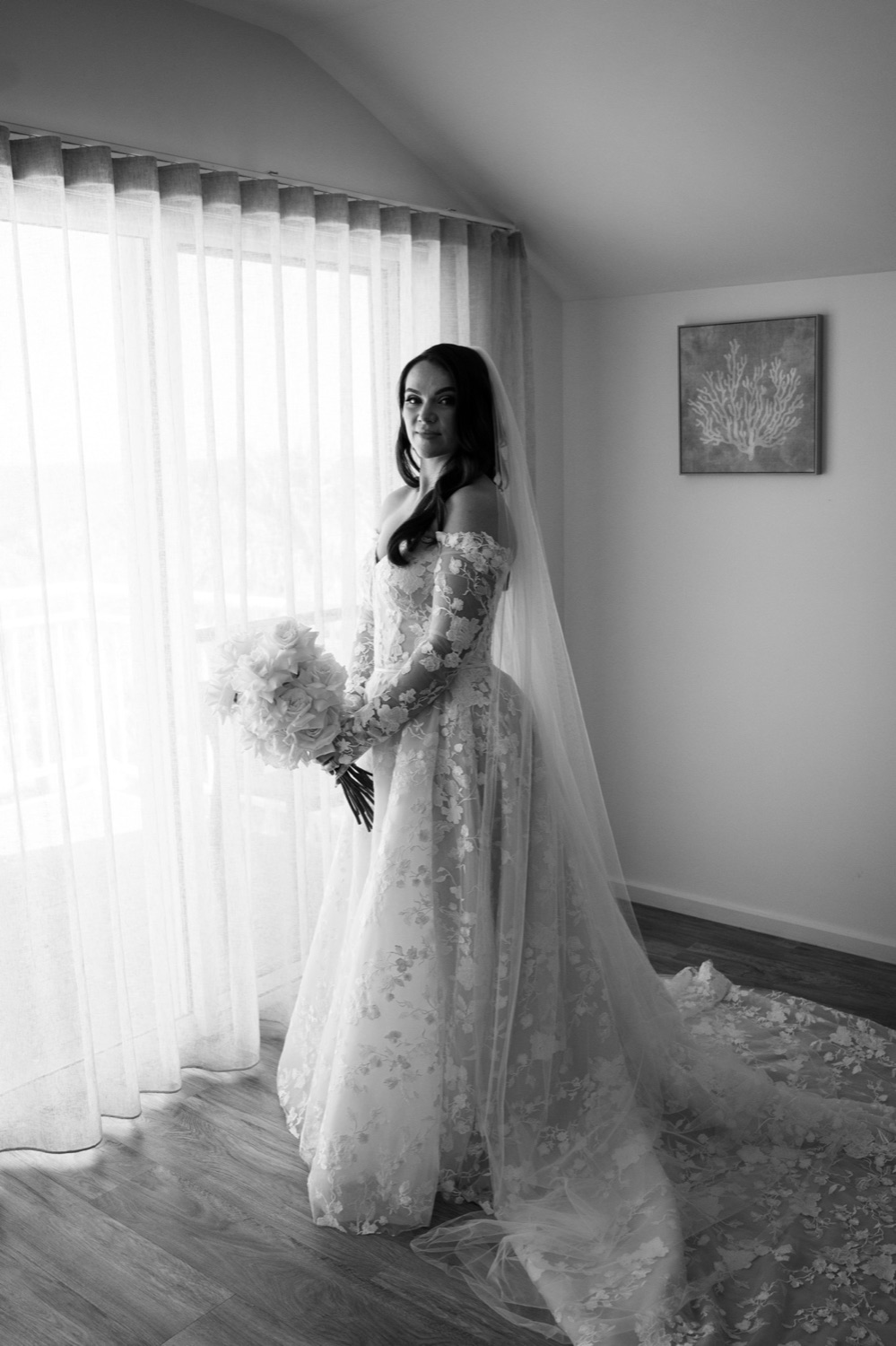 Portrait by the window, in black and white. Jemma & Matthew's wedding at Caves Coastal Bar & Bungalows, Newcastle