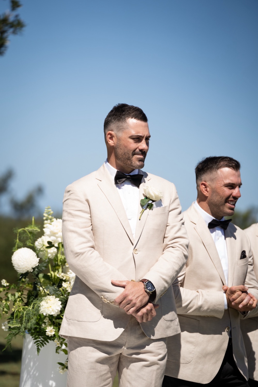 Waiting for the ceremony on the headland. Jemma & Matthew's wedding at Caves Coastal Bar & Bungalows, Newcastle