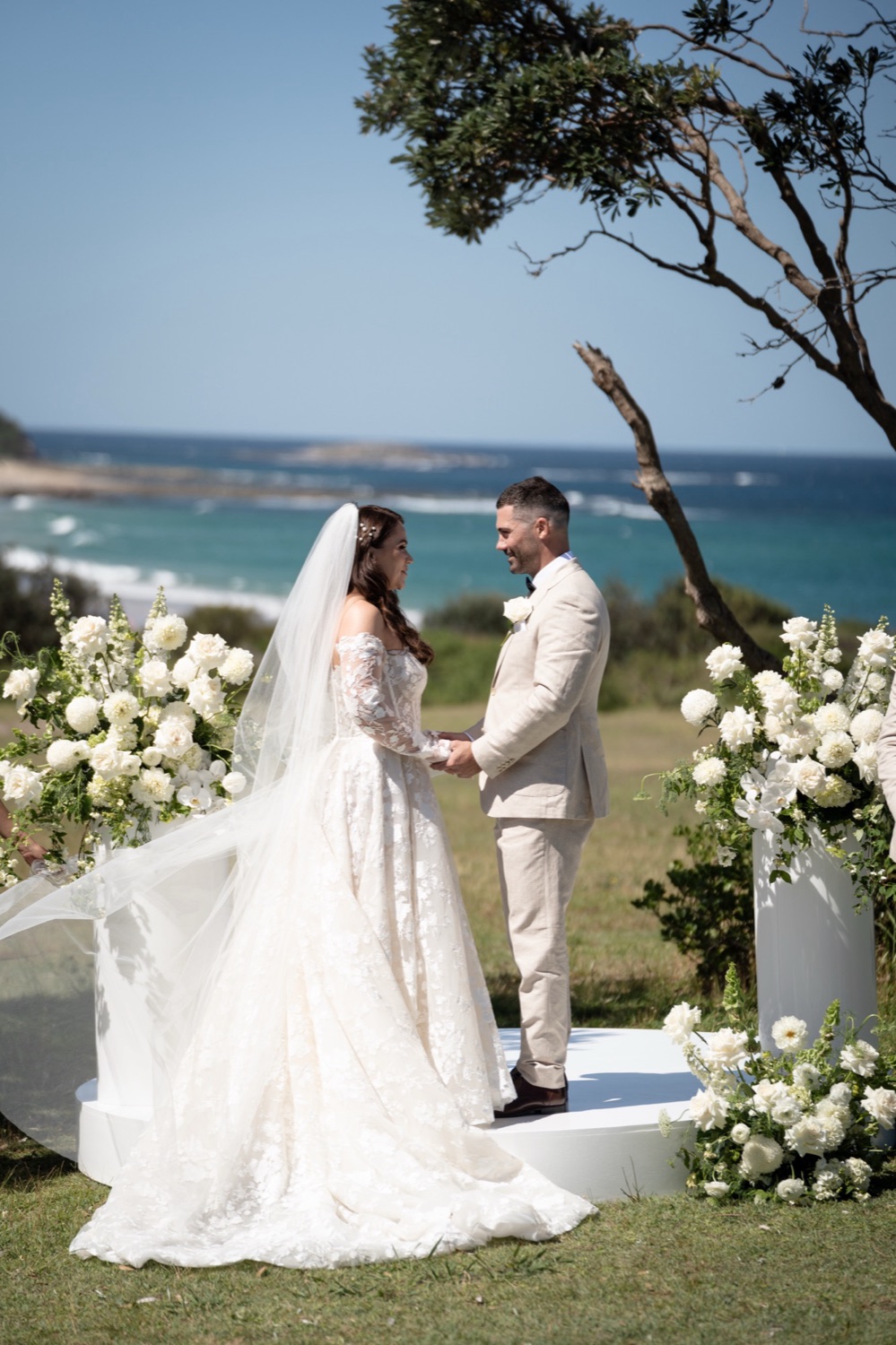 Vows on the headland above the ocean. Jemma & Matthew's wedding at Caves Coastal Bar & Bungalows, Newcastle