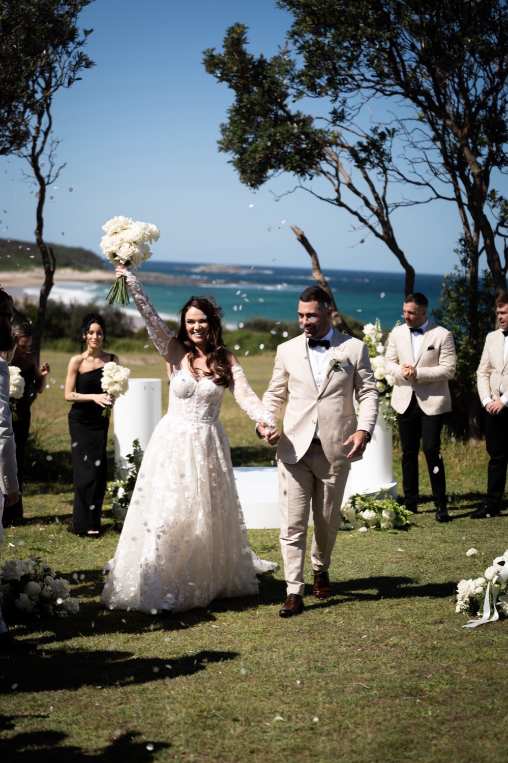 Walking back down the aisle on the headland. Jemma & Matthew's wedding at Caves Coastal Bar & Bungalows, Newcastle