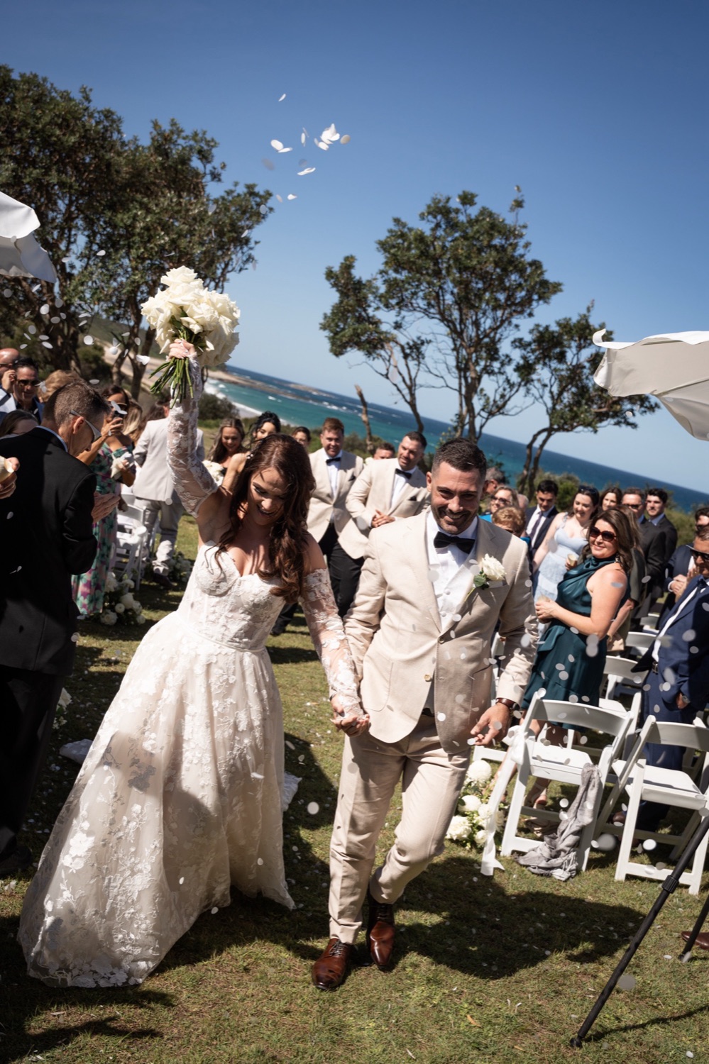 Confetti on the headland. Jemma & Matthew's wedding at Caves Coastal Bar & Bungalows, Newcastle