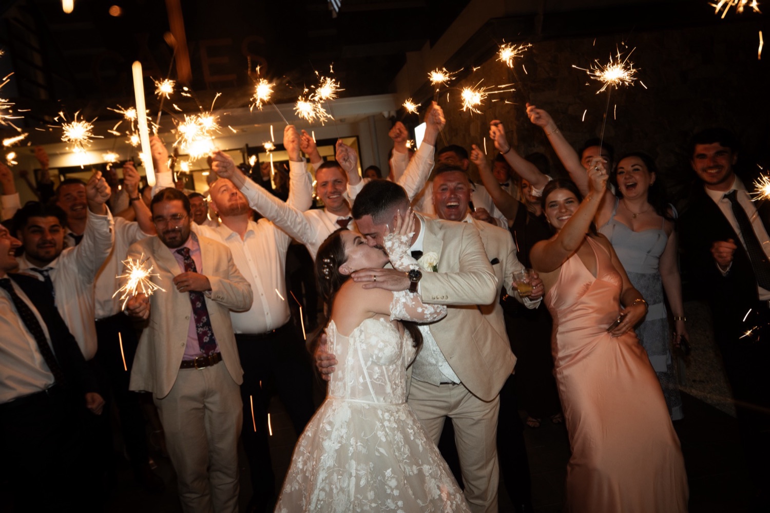 Dancing in a shower of sparklers. Jemma & Matthew's wedding at Caves Coastal Bar & Bungalows, Newcastle