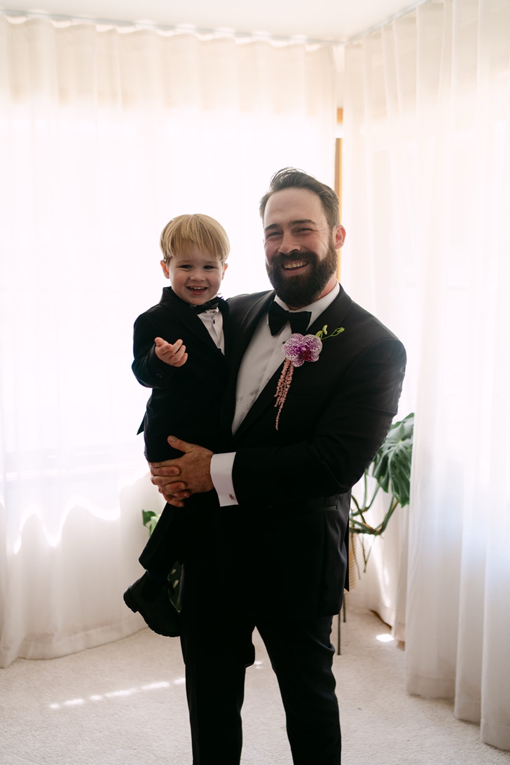 Holding a little one before the ceremony. Jessica & Ricky's wedding at Chapel of Light, Port Stephens