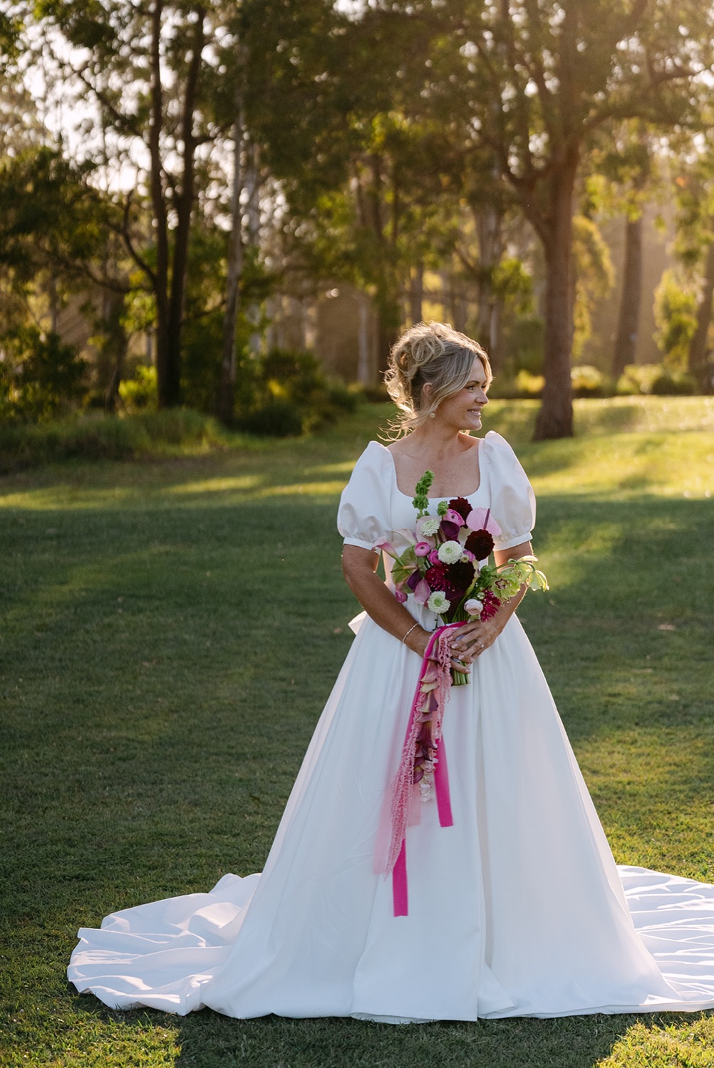 Portrait with the bouquet among the trees. Jessica & Ricky's wedding at Chapel of Light, Port Stephens