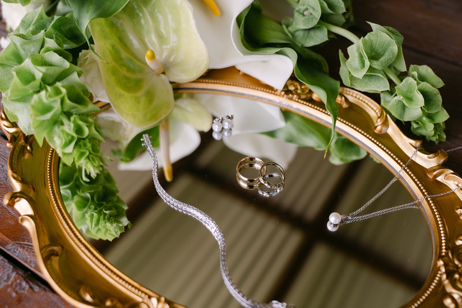 Rings and flowers on a gold tray. Jessie & Jack's wedding at Enzo, Hunter Valley