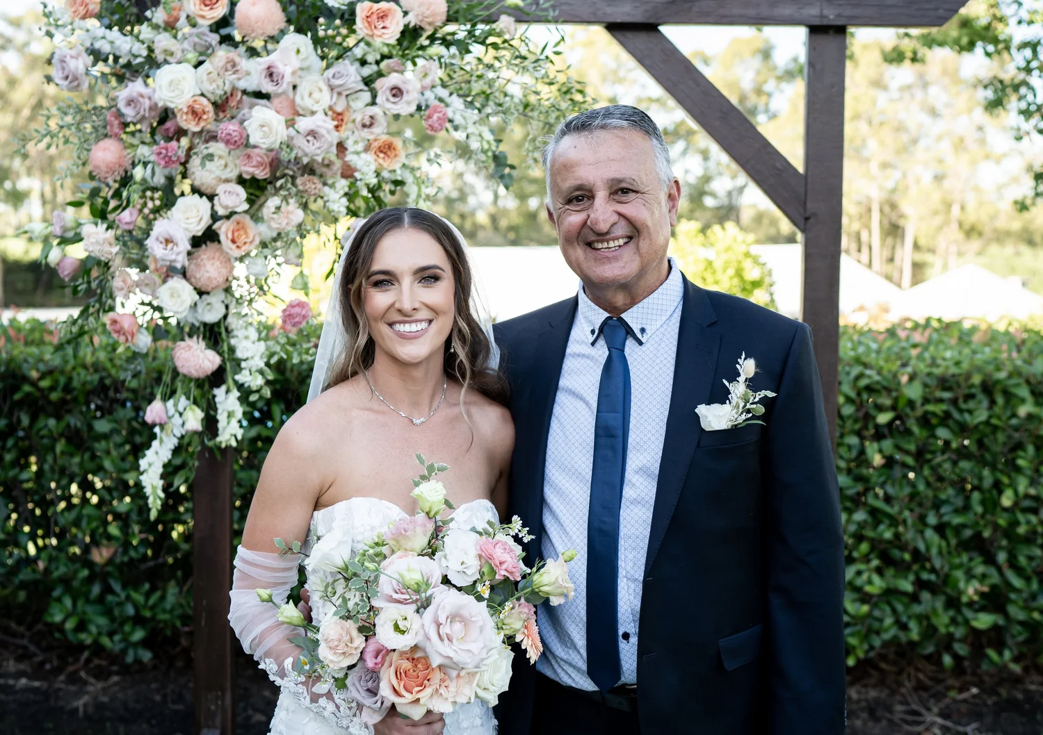 A moment with family under the arbour. Kaitlin & James's wedding at Oaks Cypress Lakes Resort, Hunter Valley