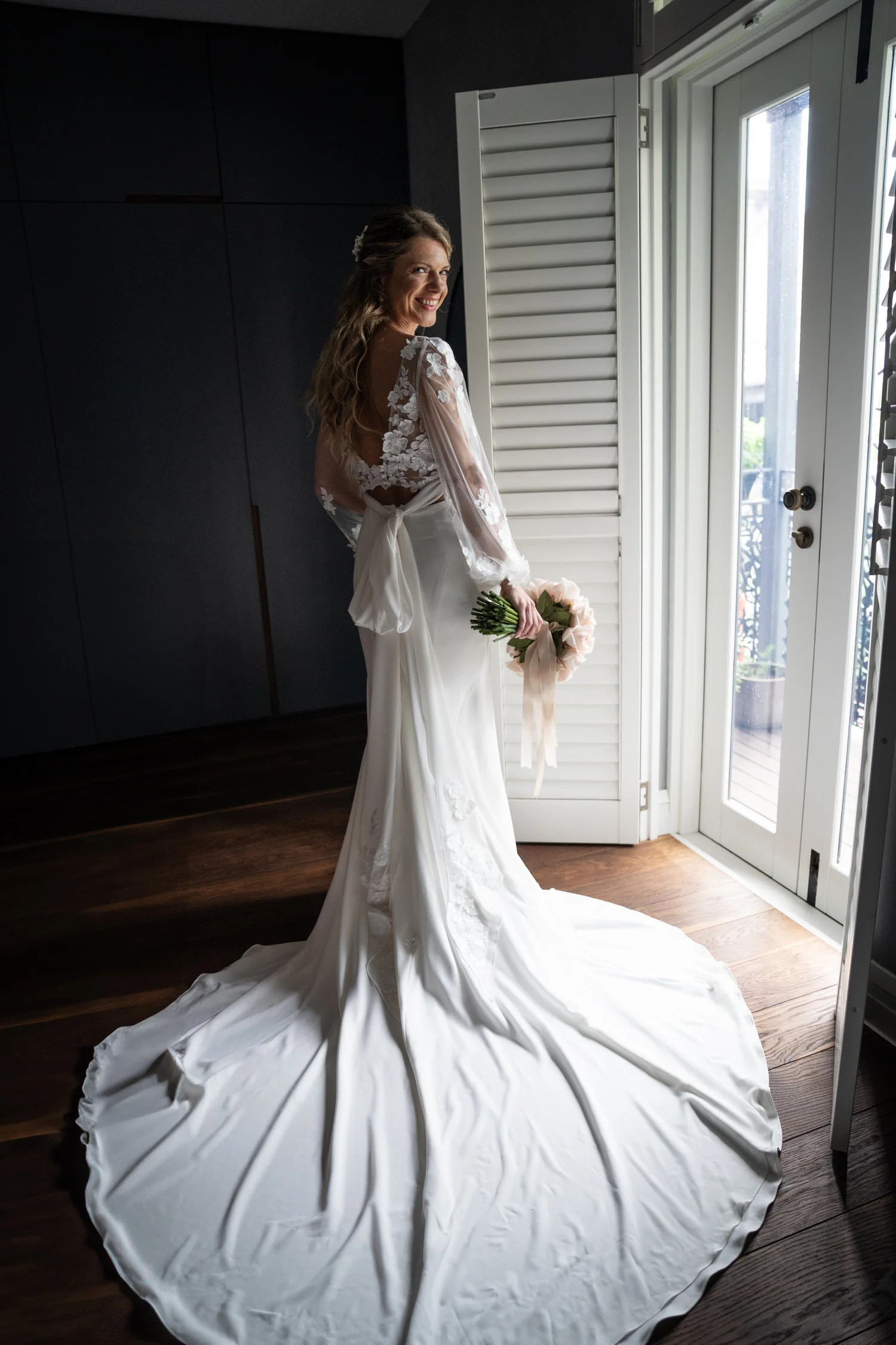 Portrait in the dress by the shutters. Kat & Aaryn's wedding at Vaucluse House, Sydney
