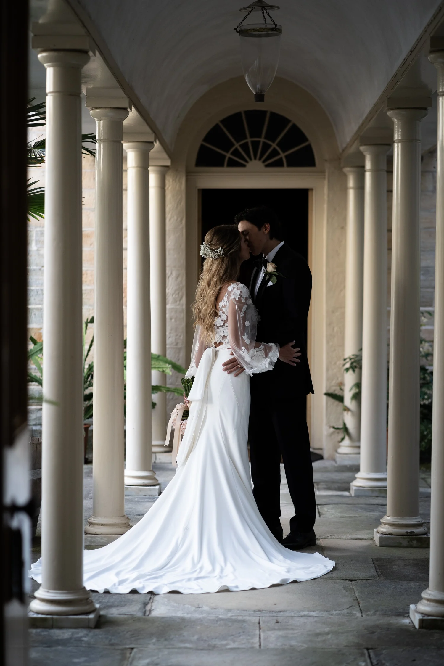 The couple in the Vaucluse House colonnade. Kat & Aaryn's wedding at Vaucluse House, Sydney
