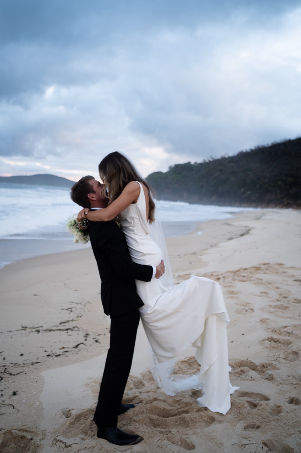 A lift on Shoal Bay beach. Lauren & Alasdair's wedding at Shoal Bay Beach, Port Stephens