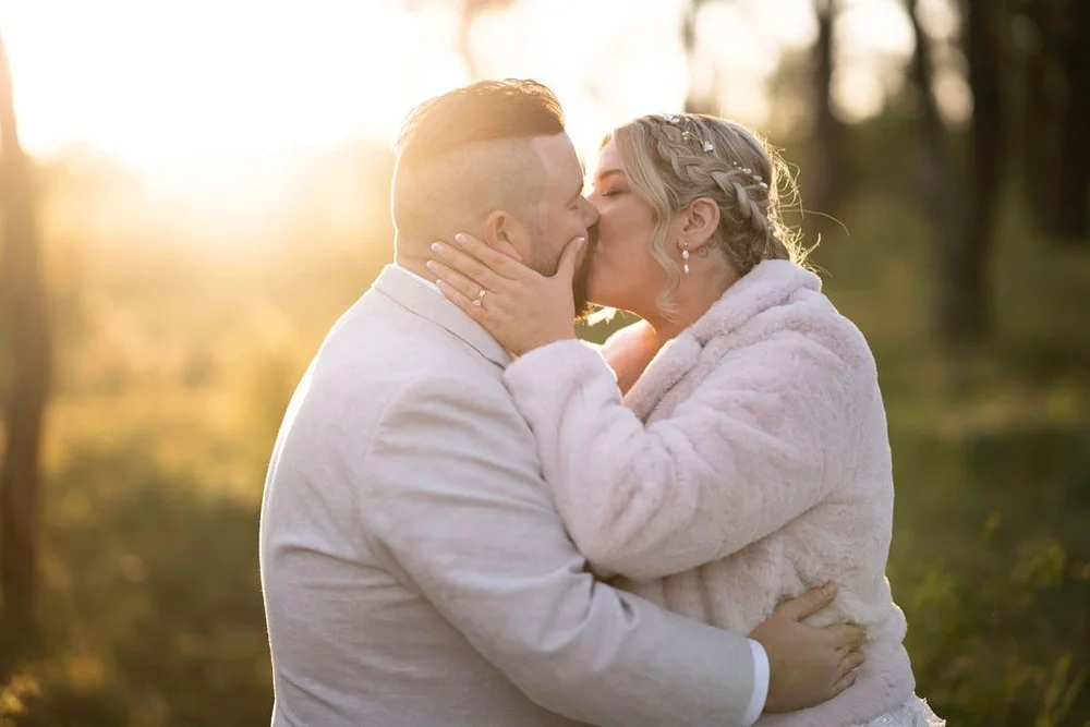 A close embrace at golden hour. Lauren & Matt's wedding at Wandin Estate, Hunter Valley