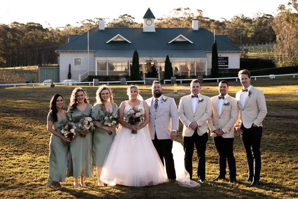 The wedding party on the lawn. Lauren & Matt's wedding at Wandin Estate, Hunter Valley