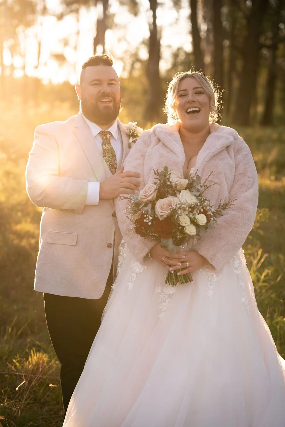 Portrait with the bouquet at golden hour. Lauren & Matt's wedding at Wandin Estate, Hunter Valley