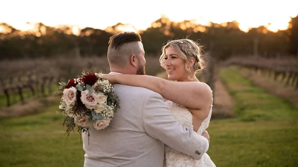 A hug among the vines. Lauren & Matt's wedding at Wandin Estate, Hunter Valley